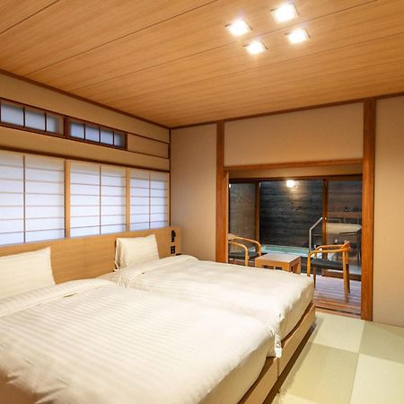 源泉掛け流しの宿albergo湯楽 Yugawara Buitenkant foto